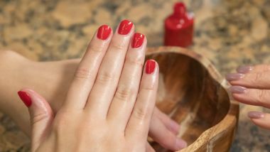 dark purple polished nails