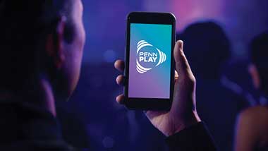 Guest holding PENN Play on phone
