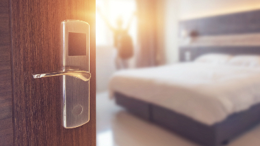 Hotel room with bed and door