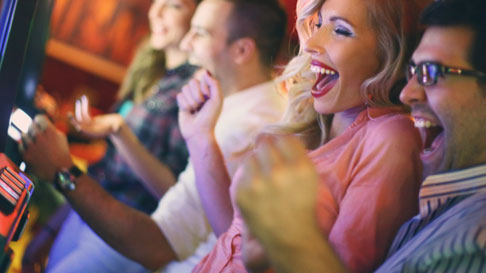 video poker - people playing at slots